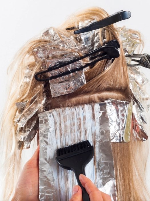 Hair colouring in progress with foils